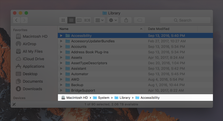 Screenshot of a Finder window in list mode. A path control showing Macintosh HD > System > Library > Accessibility is highlighted at the bottom of the window.